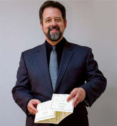 Steve Johnson holding 22" long printed piece.